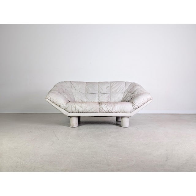 We are offering a cool vintage leather two-seater sofa for sale. The piece is reminiscent of designs by Burkhardt...