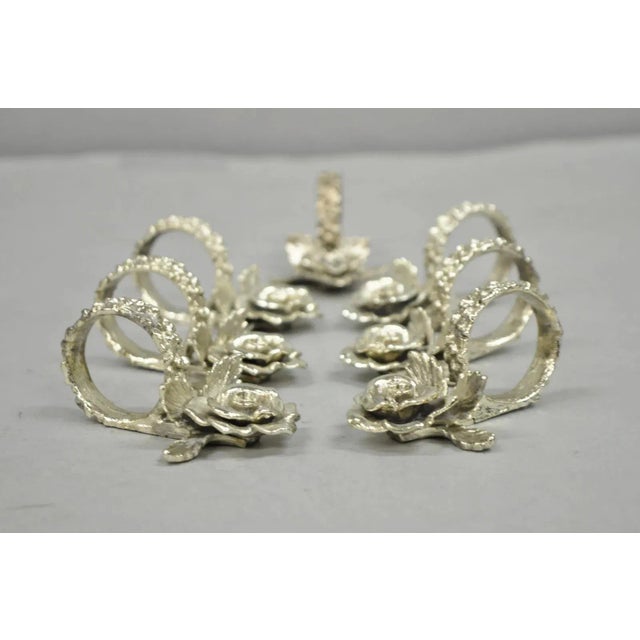 Vintage Princess House Victorian Rose Silver Plated Napkin Rings - 7 Pc Set. Circa Late 20th Century. Measurements: 2" H x...