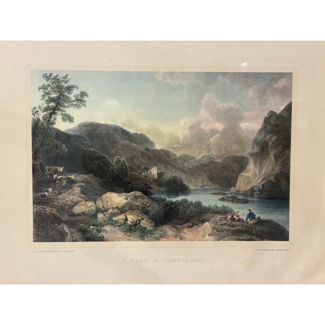 An elegant framed landscape print titled *A Lake in Cumberland*, after the work of celebrated landscape painter Philippe-...