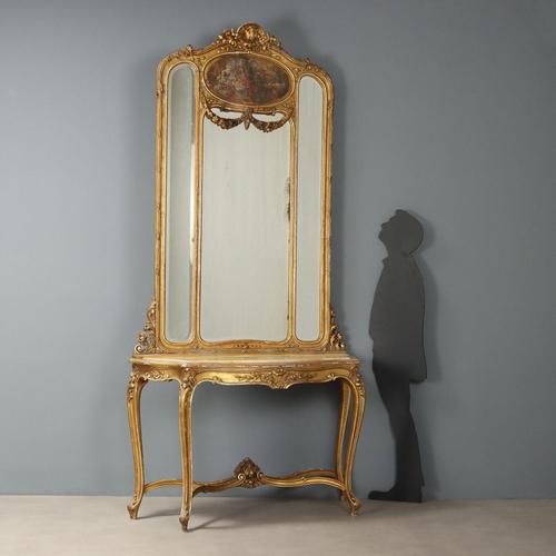 Console table with period mirror. Yellow marble top supported by four curved legs carved with scrolls, flowers, and...