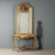 Console table with period mirror. Yellow marble top supported by four curved legs carved with scrolls, flowers, and...