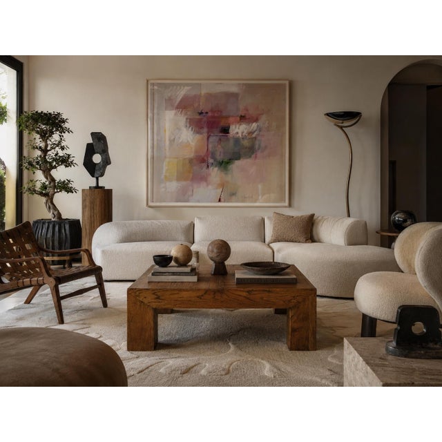 Striking 1980s Postmodern coffee table featuring a substantial Parsons-style silhouette with bold block legs and a warm,...
