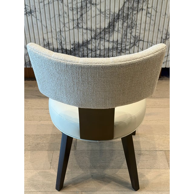 The Loleta side dining chair blends classic Klismos-inspired styling with modern finishes. A curved back with antique...