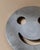 This playful vintage metal coaster from 1980s Italy brings a joyful touch to everyday life with its distinctive smiley-...