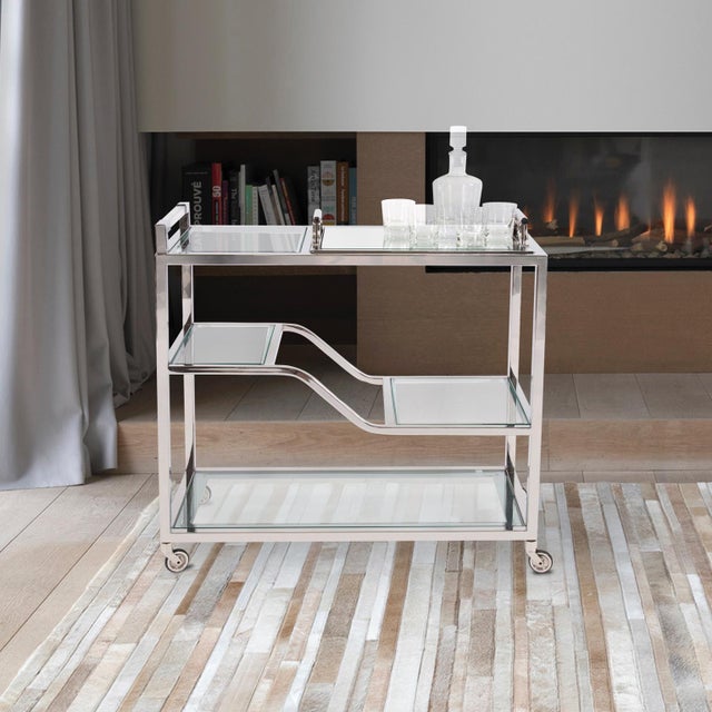 The contemporary host is looking for function and style. Both of these elements are met with our Graves Bar Trolley in...