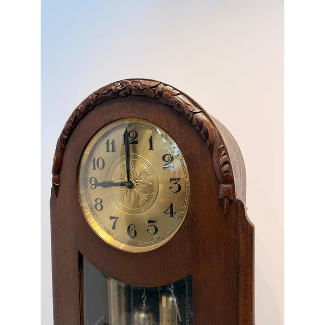 Art Deco Longcase Clock A distinguished Art Deco longcase clock featuring a beautifully crafted dark wood case with...