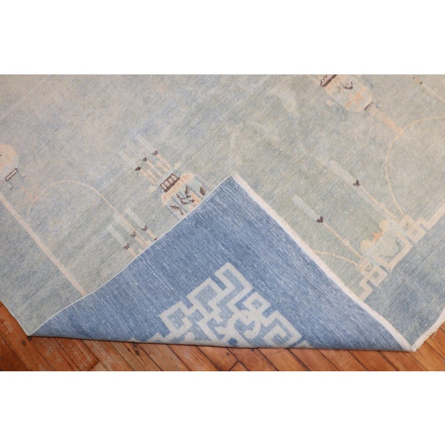 An early 20th century Chinese run in the palest of blues Measures: 6'1'' x 9'.