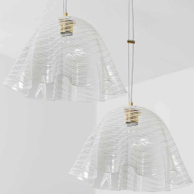 One of the two beautiful high quality Mid century glass pendants with beautiful lines. Designed and executed by Kalmar...