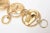 This is part of Chairish’s Costume Jewelry assortment. This unusual link Japanese gold plated bracelet has 4 abstract face...