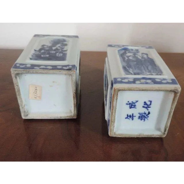 Pair antique 19th c. Chinese blue and white porcelain brush pots or vases. Each pot of square form with raised panels...