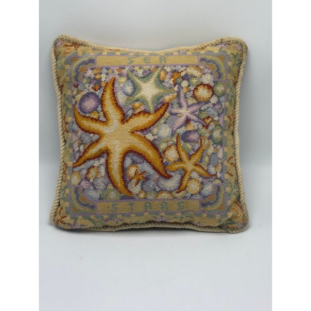 This is a charming vintage needlepoint accent pillow featuring a wonderful coastal sea-life motif. The hand-worked front...