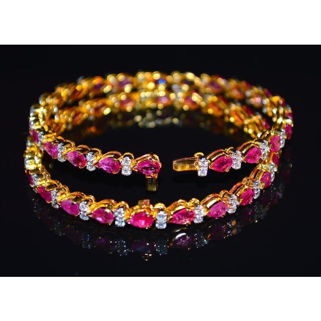 1 Gorgeous 18K solid gold 10.35CTS diamond and ruby bangle. Pictures show two bangles, however one bangle is already sold,...