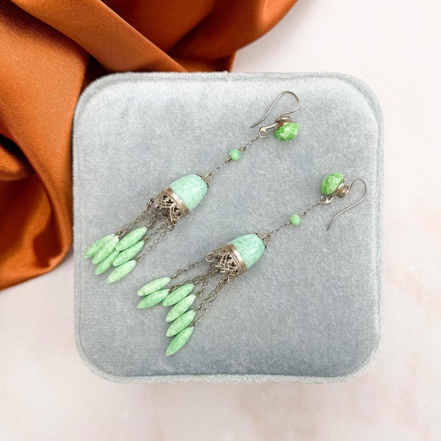 These elegant earrings, featuring beautiful Jade inspired green glass, date from the 1920s. They were most likely made in...