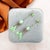 These elegant earrings, featuring beautiful Jade inspired green glass, date from the 1920s. They were most likely made in...