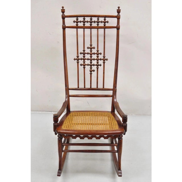 Antique Victorian Aesthetic Movement Chestnut Stick & Ball Spindle Rocker Rocking Chair. Item features a shapely sculpted...