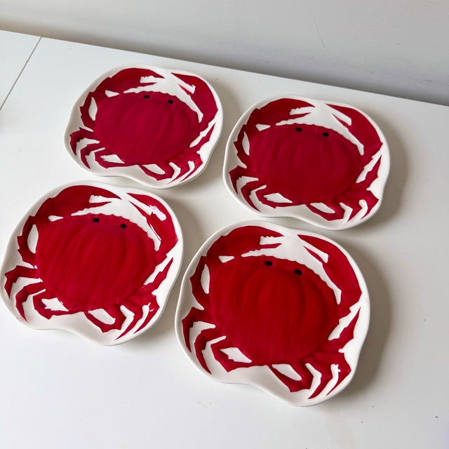 Vintage coastal red crab hand painted ceramic appetizer plates in curved shape.