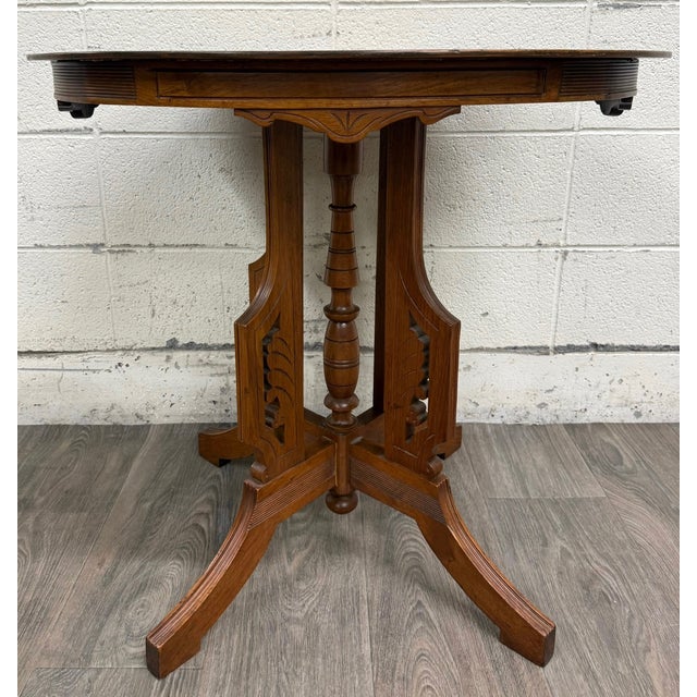 This is a stunning antique Victorian Eastlake quarter sawn tiger oak parlor table. Circa 1890–1905. Features a circular...