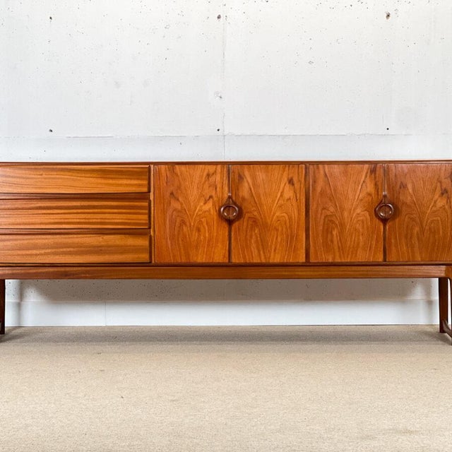 This sideboard is a unusual model very rare to come across in the market. Tom robertson the head of design of a.h....
