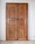 A nineteenth-century French communication door of double-leaf, double-sided construction in blond walnut, offered complete...