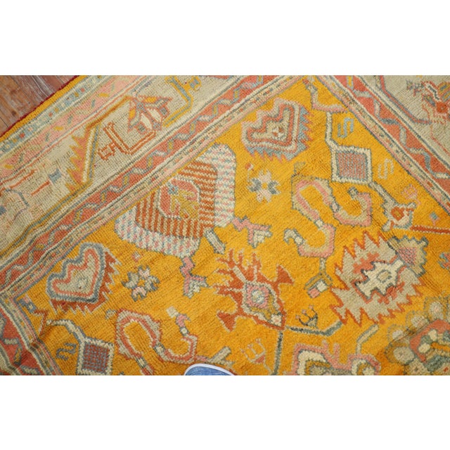 Stunning early 20th-century golden rod mango color antique Turkish Oushak rug in excellent condition Measures: 7'1" x 9'9".