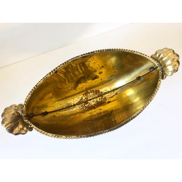 Vintage brass footed cachepot with acanthus leaf handles. Made in Italy.