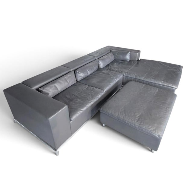 The de sede ds-7 corner sofa in elegant gray is a high-quality swiss design piece by antonella scarpitta. With its...