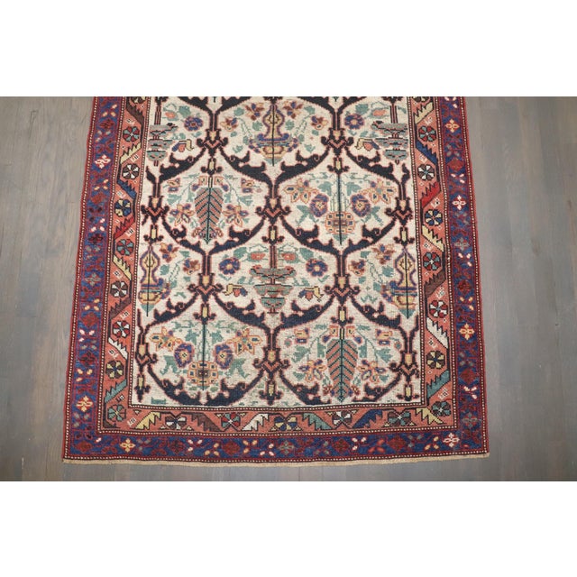 An ivory field early 20th century Persian Bakhtiari Rug