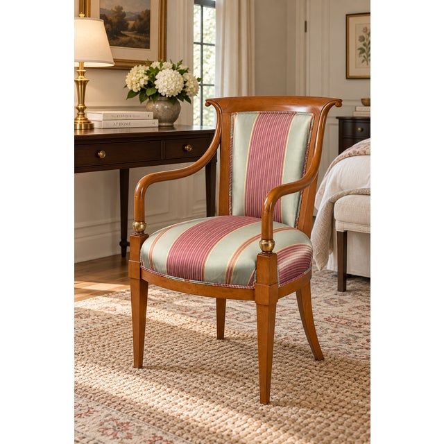 This distinctive armchair by William Switzer interprets French Empire design with an elegant, sculptural profile. Its...
