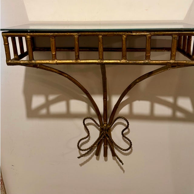 Italian Gilt Iron Faux Bamboo Wall Mounted Shelf / Console table. New distressed mirrored top. Has rings on back for...