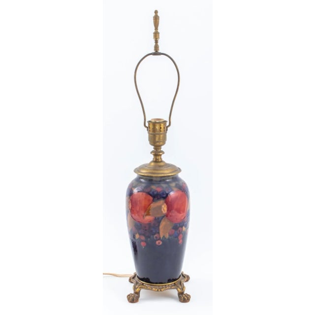 Moorcroft Pottery "Pomegranate" Pattern Baluster Vase Mounted as a Lamp, 1920s. Overall: 26" H x 6.5" Diameter....
