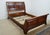 Queen Bed by Ethan Allen. Store item #548. It features solid wood construction and comes with slats.