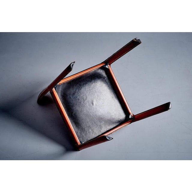 This chair by Tito Agnoli for Matteo Grassi is a refined example of Italian modern design. Fully wrapped in hand-stitched...