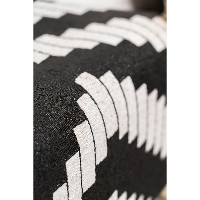 A Yoruba royal beaded chair from West Africa, worked in a striking geometric pattern of black and white beads. Each one...