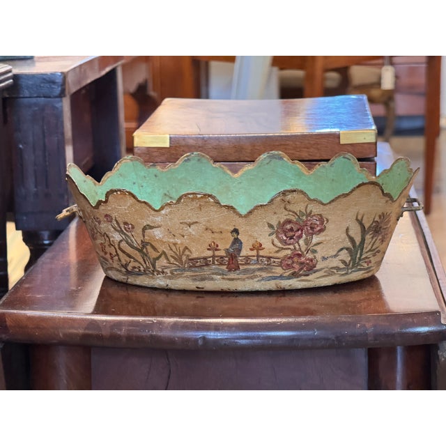 A painted tôle monteith with a scalloped rim and applied side handles, the exterior decorated with a hand-painted...