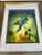 This framed art duo features two distinct nature-themed subjects: a detailed Blue Jay and a whimsical tree-filled with...