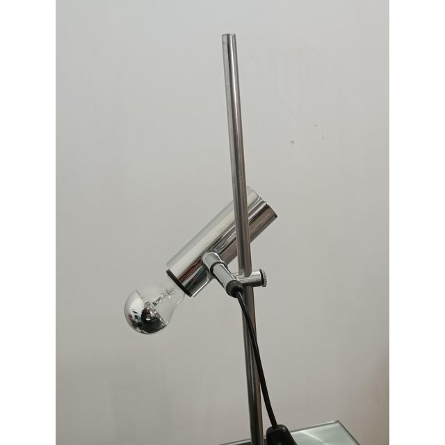 Beautiful table lamp by Staff Leuchten. Germany, 1970s. Matte black lacquered metal base. The arm supporting the reflector...