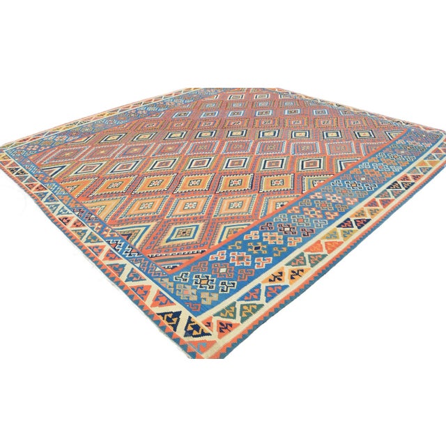 Dimensions: 172″ x 176″ Material: Wool on wool and natural dyes Condition: Original rug is unused, and is in very Good...