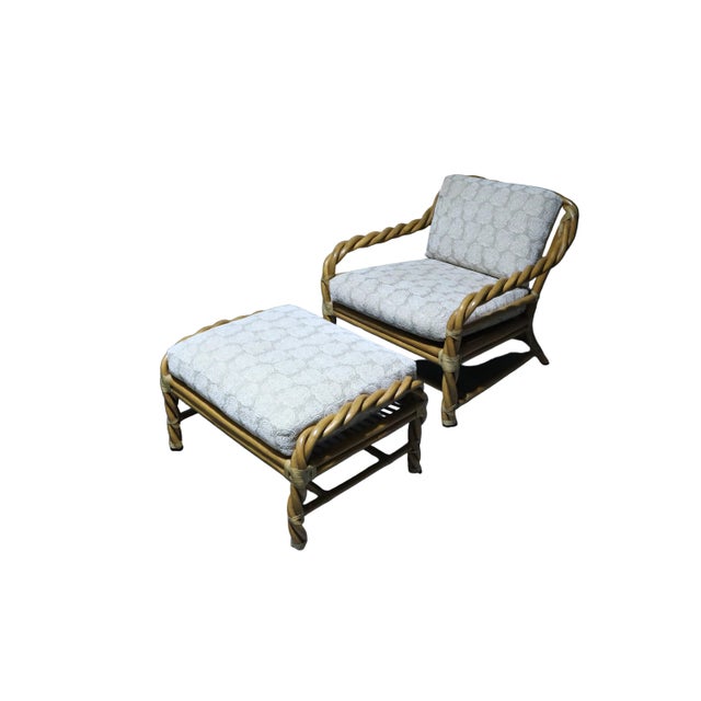 Fantastic vintage pair of McGuire living room arm chairs with matching ottomans. Chairs are constructed from twisted...