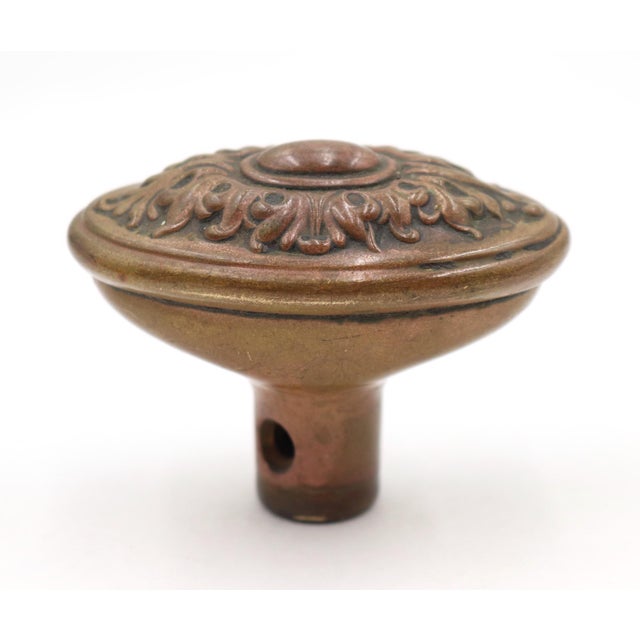 This oval Victorian brass door knob was made by Corbin in the 1911 catalog. It was part of the N-13900 Coruna catalog....