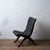 A Pierre Lottier woven leather lounge chair with an oak frame and nailhead trim, from Spain, 1960s. 18 inches wide by 23 ¼...