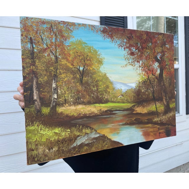This autumn scened depicted in oil paint on canvas is brightly colored with chartreuse, bright orange and terra cotta...