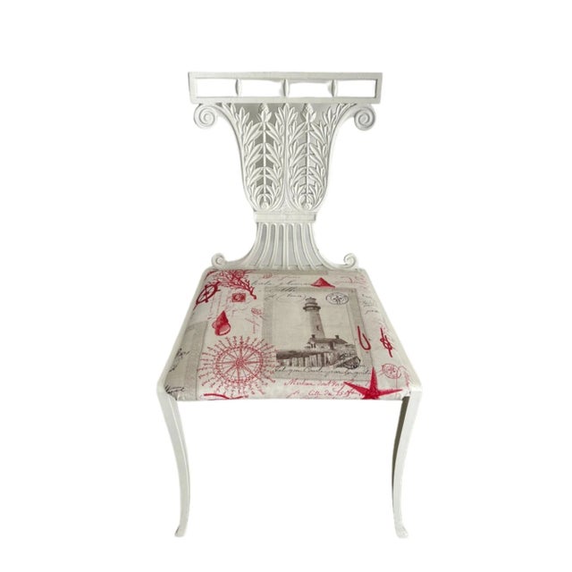 White side chair made of cast iron in Regency style. Back features a stunning of foliage scrolled to a gallery rail top....