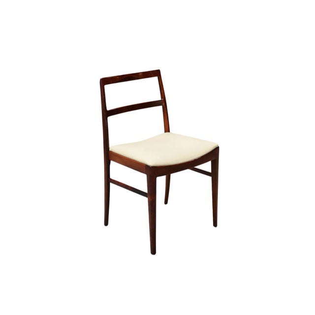 Experience the timeless elegance of mid-century design with this set of four Arne Vodder Model 430 Dining Chairs,...