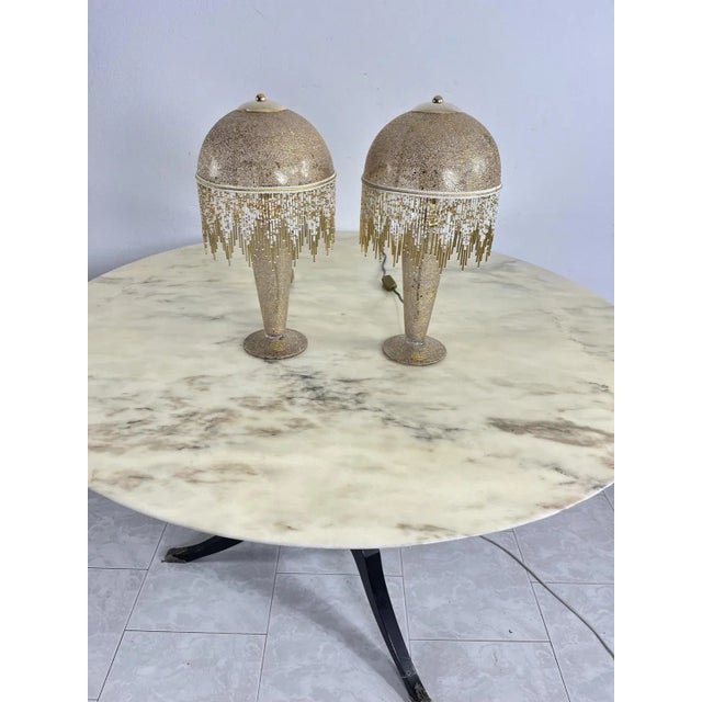 Set of 2 table lamps in mouth-blown glass hand-decorated with 1980s pure gold. Entirely made of glass, including the...