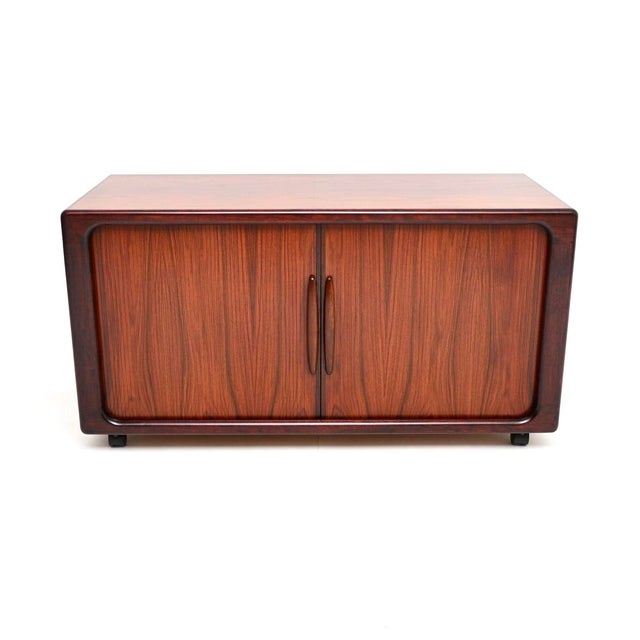 A very useful and extremely well made Danish vintage tambour door cabinet / sideboard by Dyrlund. This was made in...