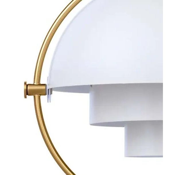 Louis Weisdorf 'Multi-Lite' pendant lamp in white and brass. Designed in 1972 by Weisdorf, this is an authorized re-...