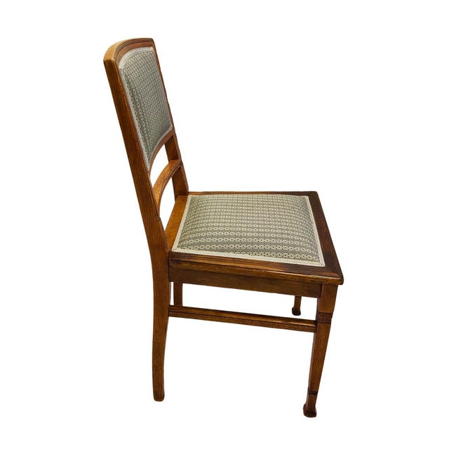 This German Art Nouveau chair, crafted around 1900, is made from solid oak and has been professionally restored and newly...