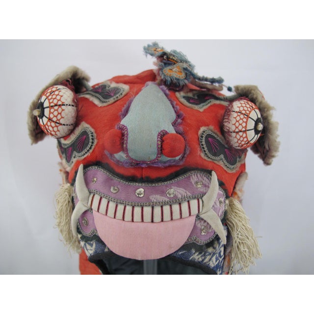 Elaborate antique Chinese festival hat in the form of a tiger or dragon, likely dating from late 19th to early 20th...