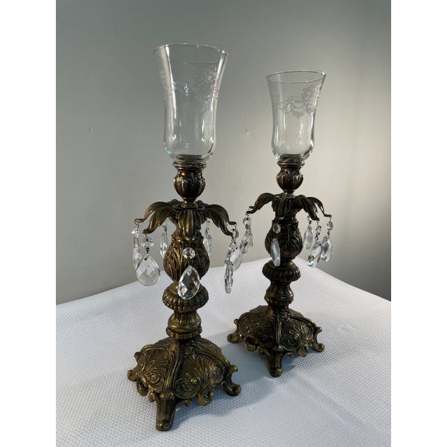 A splendid pair of French Baroque style Candle Holders with lovely etched votive cups and light catching crystals. Circa...