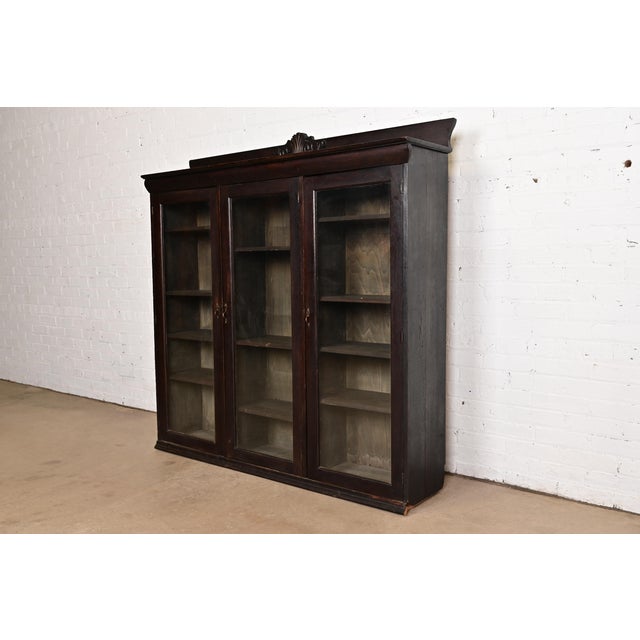 A gorgeous antique American Empire, Victorian, or Arts & Crafts bookcase cabinet In the manner of R.J. Horner & Co. USA,...